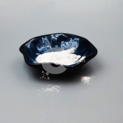 Off-white Phenylethyl Resorcinol powder in dark ceramic dish, used in skin lightening and pigmentation control formulations