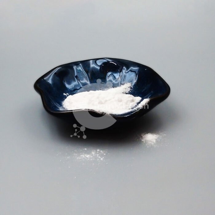 Off-white Phenylethyl Resorcinol powder in dark ceramic dish, used in skin lightening and pigmentation control formulations