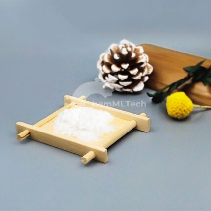 White Kojic Acid powder on bamboo tray, with pinecone and dried flowers, used in skin tone-evening and anti-spot skincare