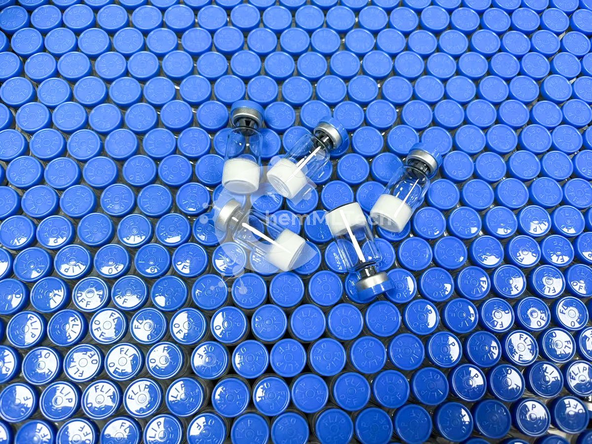 Photo of Snap 8 Peptide lyophilized powder in glass vials with blue flip-off caps, used in cosmetic anti-aging formulations