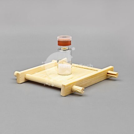 Selank Lyophilized Powder in a clear glass vial placed on a bamboo tray, ideal for research and laboratory use, presented by ChemMLTech.