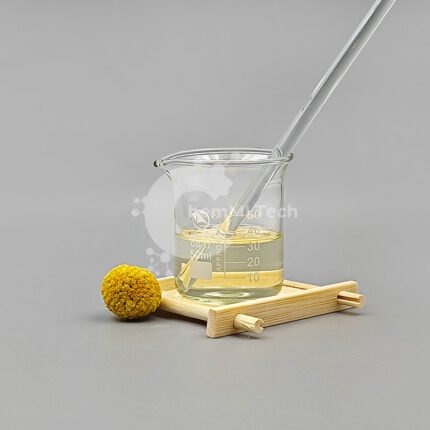 Clear yellow liquid Cyclohexylamine in a lab beaker with a glass stirring rod