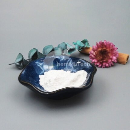 Pure white powder of L-tert-Leucine methyl ester hydrochloride (CAS No. 63038-27-7) displayed in a blue bowl, surrounded by decorative flowers and greenery.
